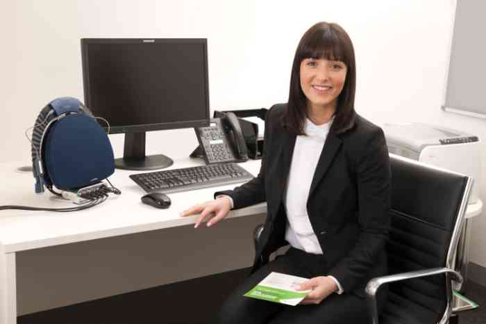 Audiologist with phone