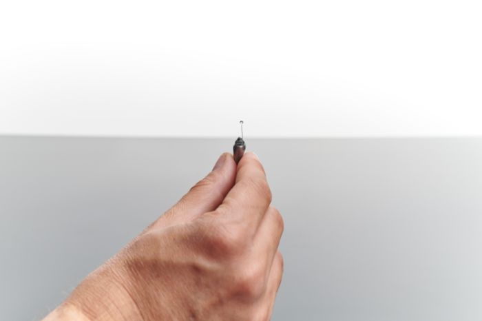 ITE hearing aid in the hand